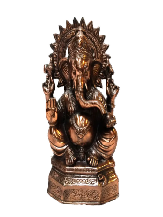 A carved black metal statue of Lord Ganesha, featuring intricate details and a base with additional decorations.